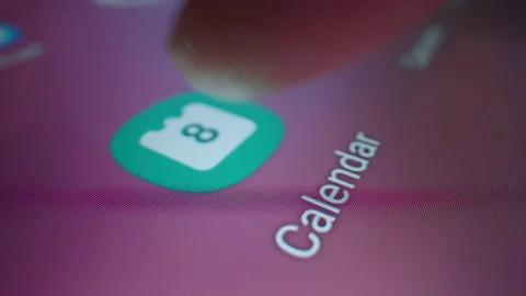 Motorized slow motion moving shot of clicking Calendar app icon Video stock 197093814