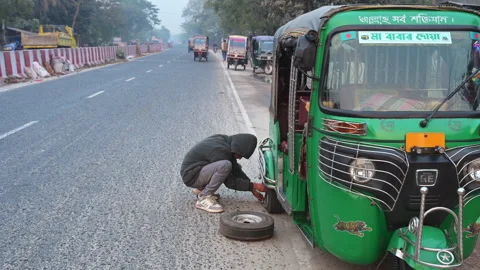 Motorized Trike Asphalt Roadside Flat Tire Repair Operator Fixing Punctured Stock Footage 336408466
