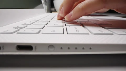 Motorized vertical dolly shot of using laptop computer Video stock 155784958