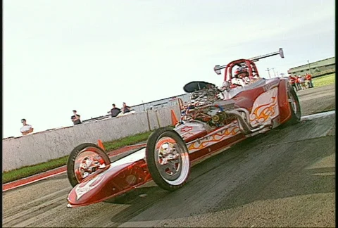Motorsports, drag race flame red altered burnout Stock Footage