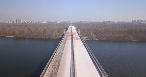 Motorway bridge under construction and passing over a forest Stock Footage 127215751