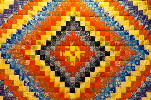Mottled background in patchwork fabrics Stock Photos