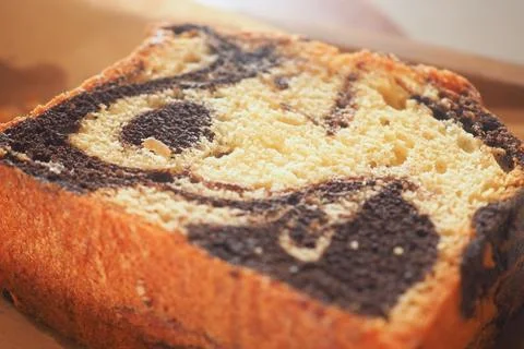 Mottled bread slice with a pattern on a brown plate Stock Photos