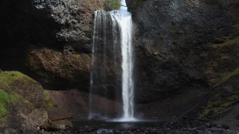 Moul Falls, a waterfall pours into a pool below in a small canyon Stock Footage 251924714