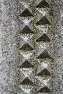 Moulded concrete wall with geometric pattern for use as a background texture Foto stock