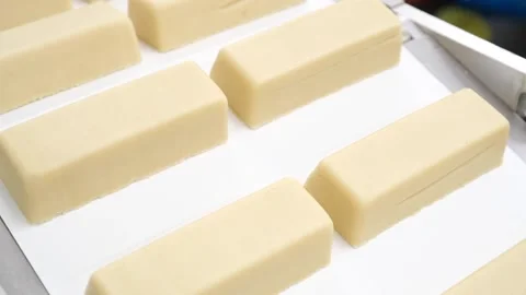 Moulded Marzipan blocks rolling of a production line Stock Footage 167652318
