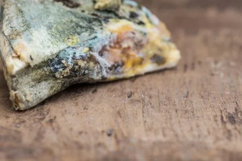 Mouldy bread on cutting board Stock Photos
