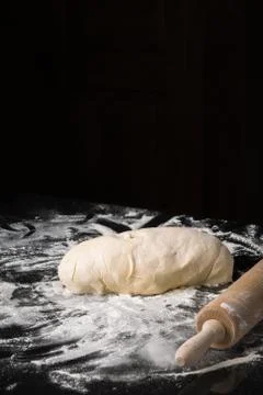 Mound of bread dough and rolling pin Stock Photos