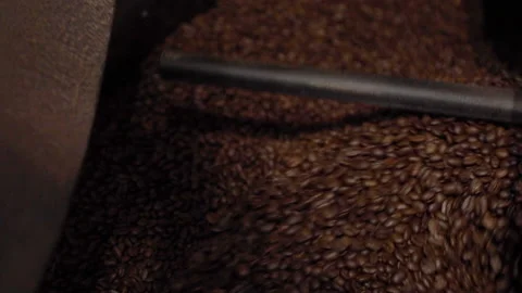 Mound of Coffee Beans Cooling After Roasted At Factory Slow Motion Vídeo Stock 143759145