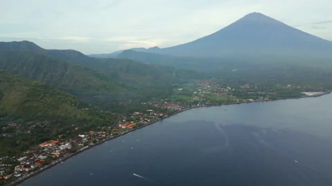 Mount Agung And Amed Beach Early Morning Haze Bali Indonesia Drone High Angle Video stock 345013959