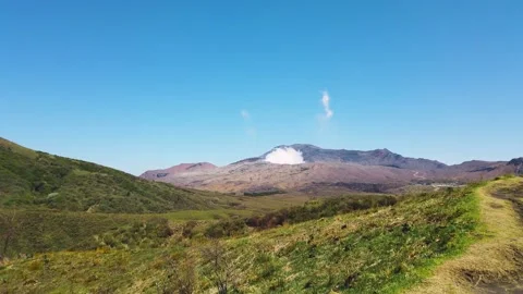 Mount Aso volcano with smoke emitting from the active crater in Japan. Stock Footage 336069290
