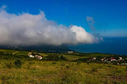 Mount Ayu Dag with clouds on the background of the Black Sea in the early mor Foto stock
