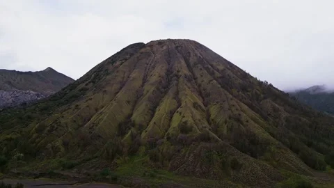 Mount Batok Mountain in East Java Captured by Drone Showing Rugged Slopes and Stock Footage 327627373