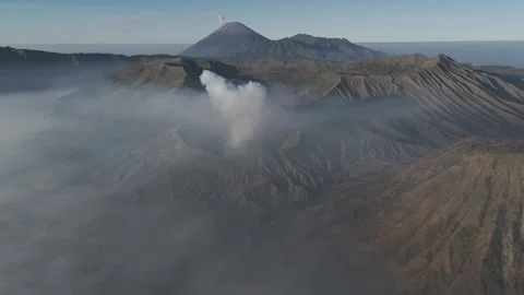 Mount Bromo Crater Surrounded by Clouds at Sunrise Stock-Footage 341998380