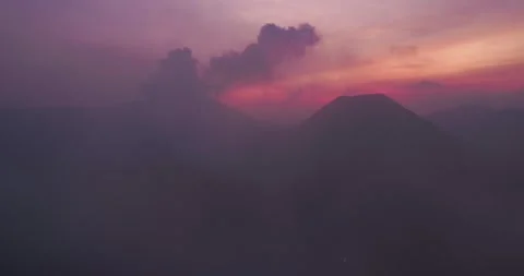 Mount Bromo Volcanic Landscape with Soft Sunset Fog Aerial View Stock Footage 329597141