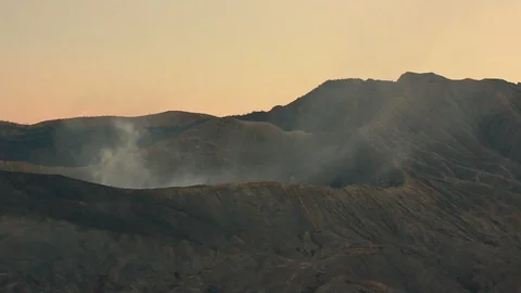 Mount Bromo volcano during sunset smoke erupting on the air at East Java, Stock Footage 113343307