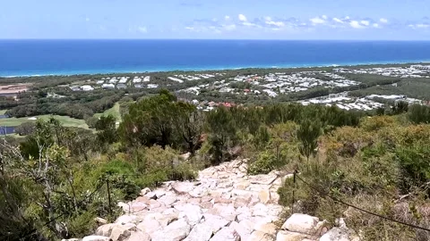 Mount Coolum Summit Trail: steep climb with rock steps and coastal views of.. Stock Footage 295240773