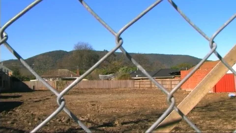 Mount Dandenong (as seen through security fence at housing development site) Stock Footage 93175299