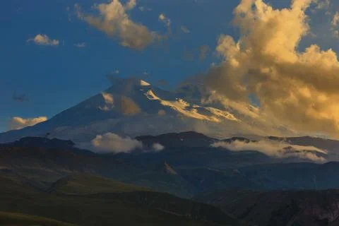 Mount Elbrus during sunset in the rays of the sun. Close-up of a mountain ran Stock Photos