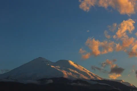 Mount Elbrus during sunset in the rays of the sun. Close-up of a mountain ran Stock Photos