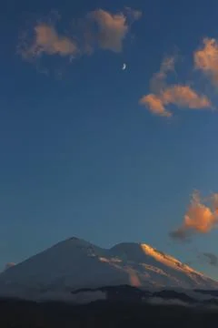 Mount Elbrus during sunset in the rays of the sun. Close-up of a mountain ran Stock Photos