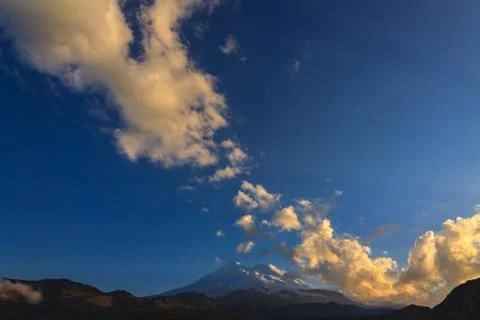 Mount Elbrus during sunset in the rays of the sun. Panoramic view of the moun Stock Photos