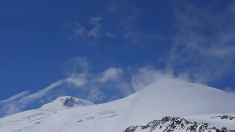 Mount Elbrus offers a view through the clouds. Stock Footage 101727950