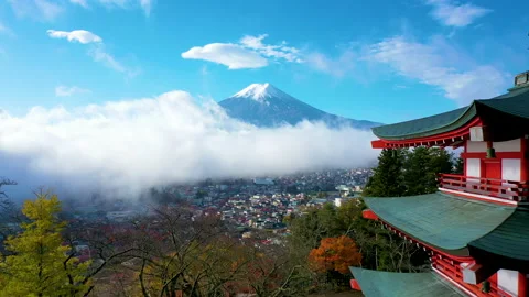 Mount Fuji and mist view from behind Chureito Pagoda on morning Stock Footage 139740621