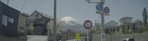 MOUNT FUJI APPROACH FROM STREETS. Anamorphic 4k LOG Stock Footage 248520782