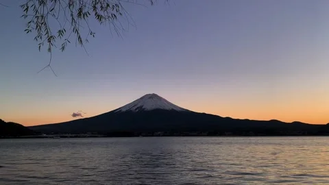 Mount Fuji in the Evening light with its snowy peak near of Kawaguchigo lake Video stock 263023941