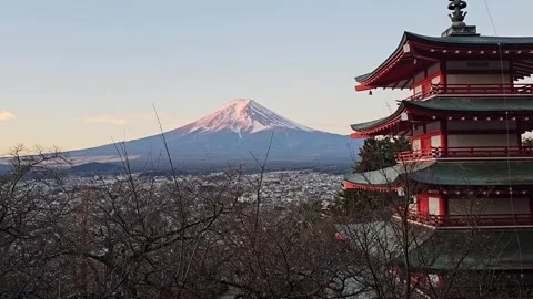 Mount Fuji glows pink beside the Chureito Pagoda, Fujiyoshida, Yamanashi, Japan Stock Footage 344532377