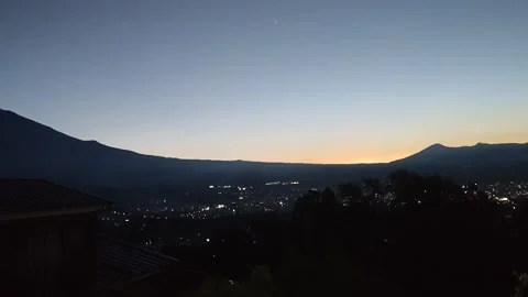Mount Fuji Silhouette at Dawn Above City Lights in Japan Stock Footage 346067643
