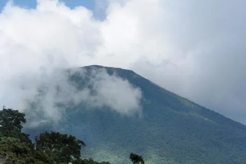 Mount gahinga in cloudy ambiance Stock Photos
