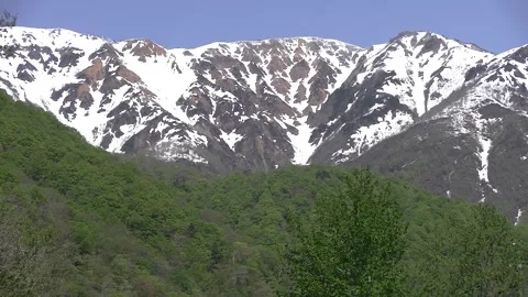 Mount Hakusan Range with Remaining Snow Under Clear Blue Sky - Japan Alps Video stock 345031456