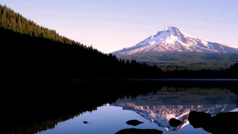 Mount hood and forest reflect in a tranquil lake in oregon Stock Footage 312680190