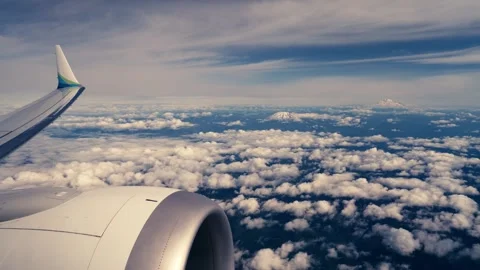 Mount Hood Mount Rainer Mount Adams Mount St Helens from Airplane Window Aerial Stock Footage 280702729