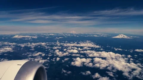 Mount Hood Mount Rainer Mount Adams Mount St Helens from Airplane Window Aerial Stock Footage 280702734