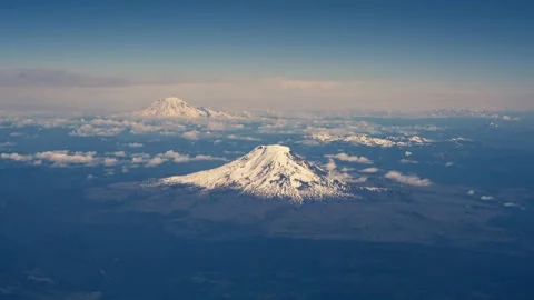 Mount Hood Mount Rainer Mount Adams Mount St Helens from Airplane Window Aerial Stock Footage 280702749