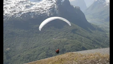 Mount Hoven, Norway - 05/06/2024: A hang glider takes off from the mountain Stock Footage 278177053