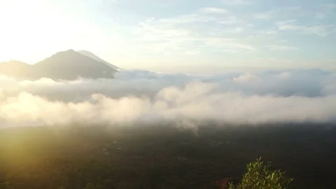 Mount in jungle and clouds around volcano Batur Bali Stock Footage 83696650