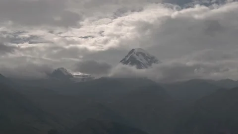 Mount Kazbek at sunrise in clouds, Mount Kazbek, Georgia Stockbeeldmateriaal 237768455