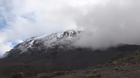 Mount Kilimanjaro is covered by clouds (time lapse). Tanzania Vídeos de archivo 56342940