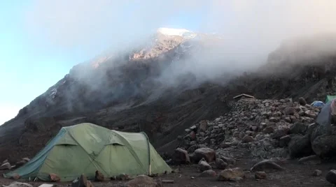 Mount Kilimanjaro is covered by clouds (time lapse). View from the camp Stock Footage 56342965