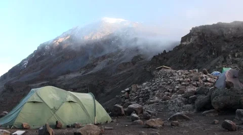 Mount Kilimanjaro is covered by clouds. View from the camp Stock Footage 56342959