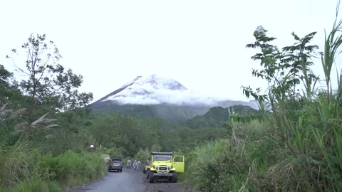 Mount Merapi erupting at sunrise seen from Lava tour Video stock 332532390