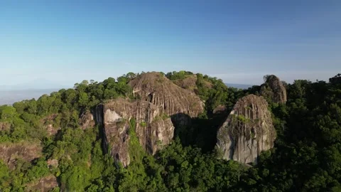 Mount Merapi seen afar from the peak of the Nglanggeran Ancient Volcano Stock Footage 347535109