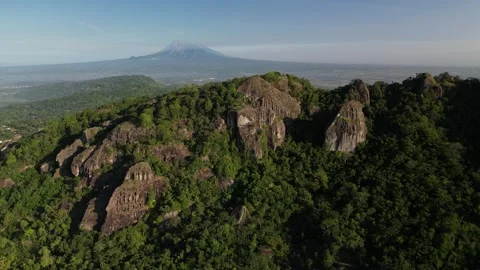 Mount Merapi seen afar from the peak of the Nglanggeran Ancient Volcano Stock-Footage 347535202