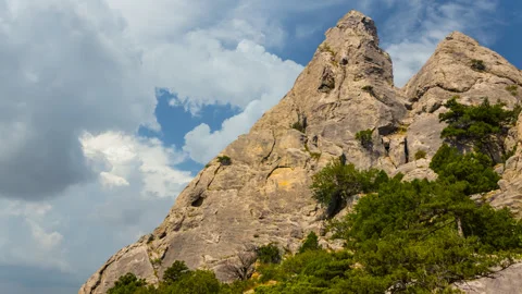 Mount peak on a blue cloudy sky backgrouns Stock-Footage 333276845