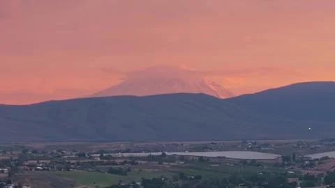 Mount Rainier Above Yakima Valley at a Pink Stormy Sunset Stock Footage 345887967