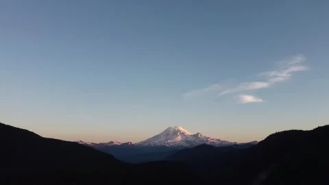 Mount Rainier bathed in Warm Dawn Alpenglow Light Stock Footage 252545094